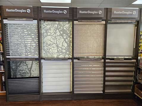 Store interior showcasing several different types of window coverings